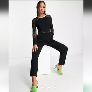 NEW French Connection body-conscious jumpsuit with mesh cut outs in black